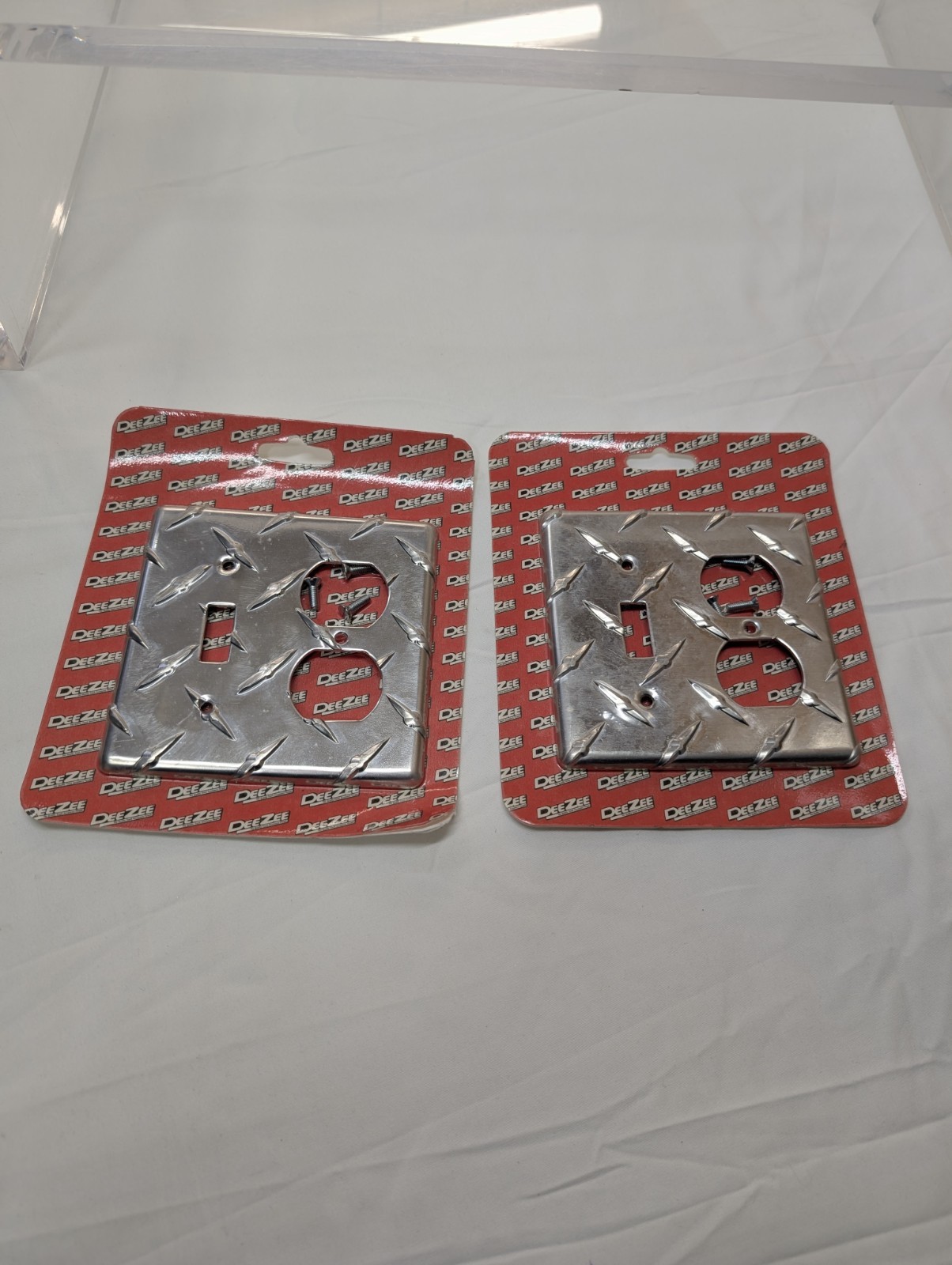 2 PCs DeeZee Brite Tread Outlet Cover. New Unopened Damaged Package