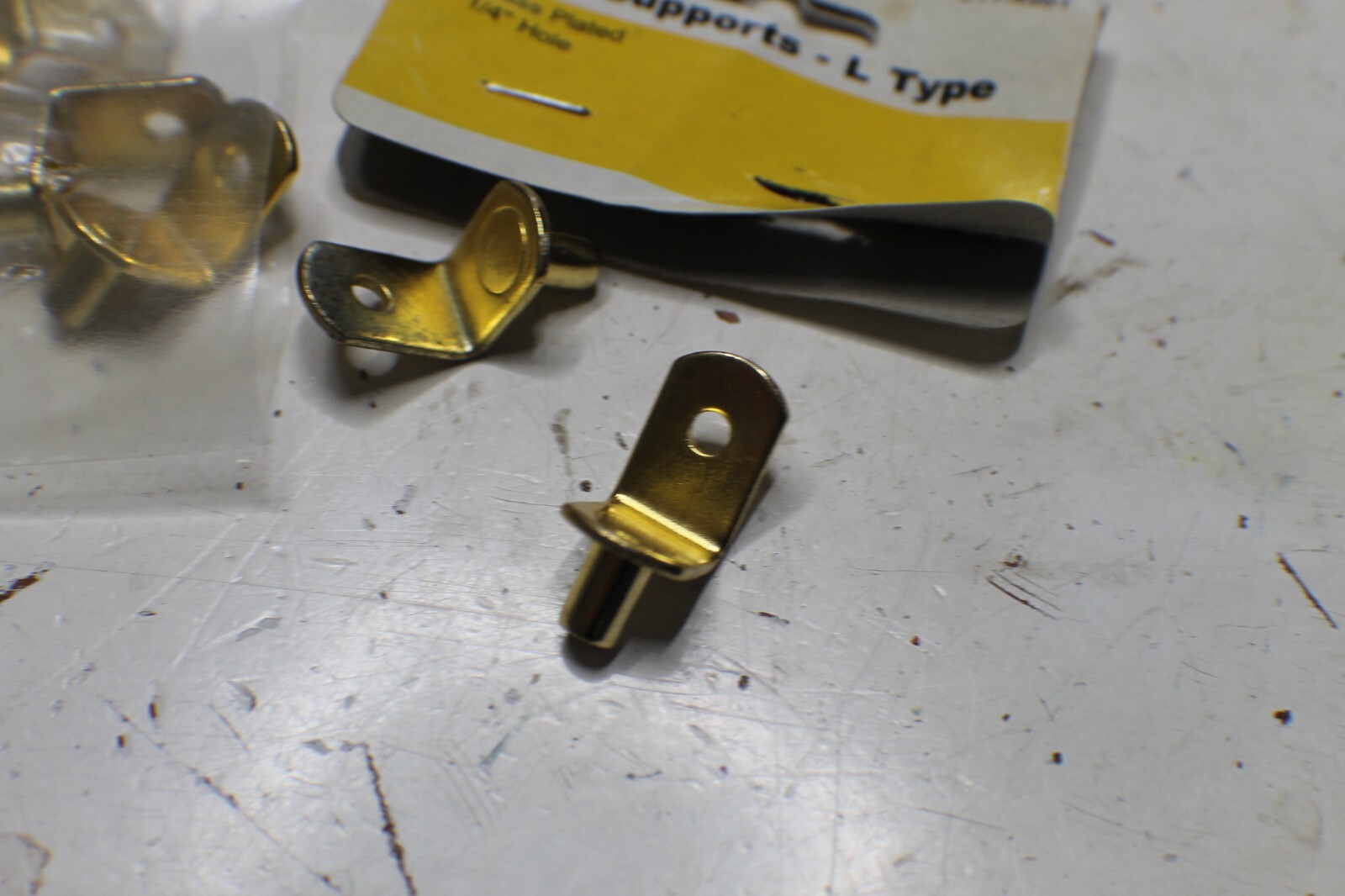 12 1/2" ~ L shaped shelf supports 1/4" hole
