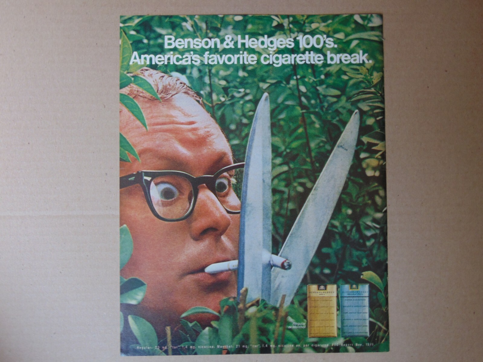 1971 BENSON & HEDGES 100's Cigarettes man cuts cigarette vintage art print ad