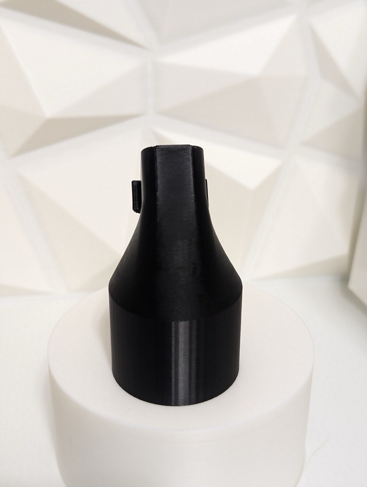 Adapter for DeWalt DW433 belt sander dust port to a common Shop-Vac 1-1/4" hose.