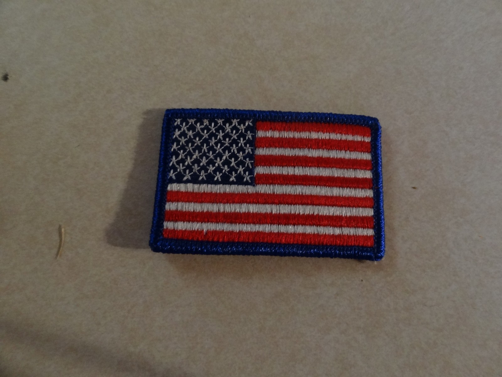 GENUINE AMERICAN FLAG PATCH BLUE TRIM 2 1/2 BY 1 1/2 INCHES SEW ON