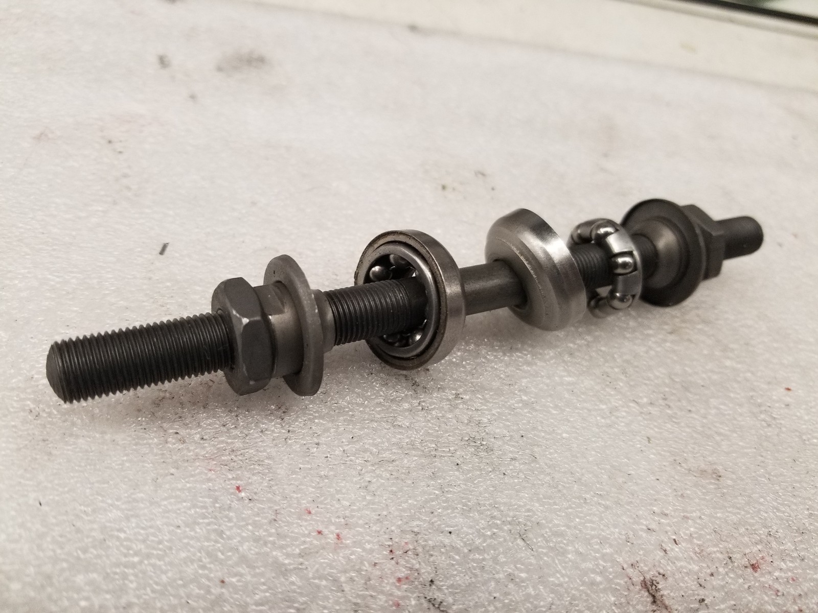 FRONT AXLE 150-MM X 3/8", 26 T.P.I.,  WITH 2-BEARING RETAINERS #-5  6 X  3/8"NEW
