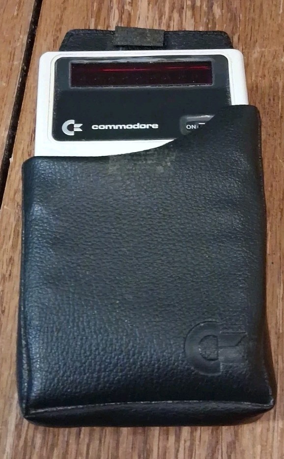 Commodore Minuteman 2-PM Hand Held Calculator W/ Case and Manual*. Untested