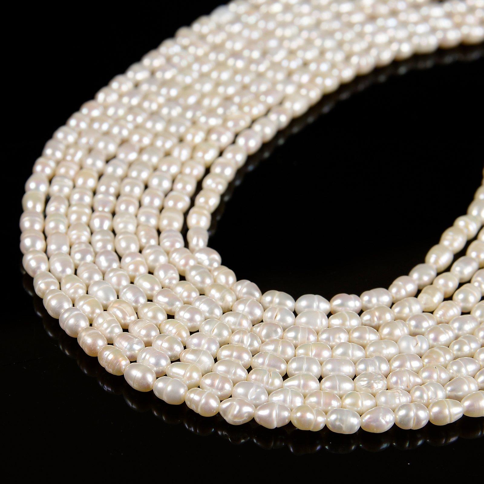 White Fresh Water Pearl Rice Shape Beads Size 4x5mm 14'' Strand