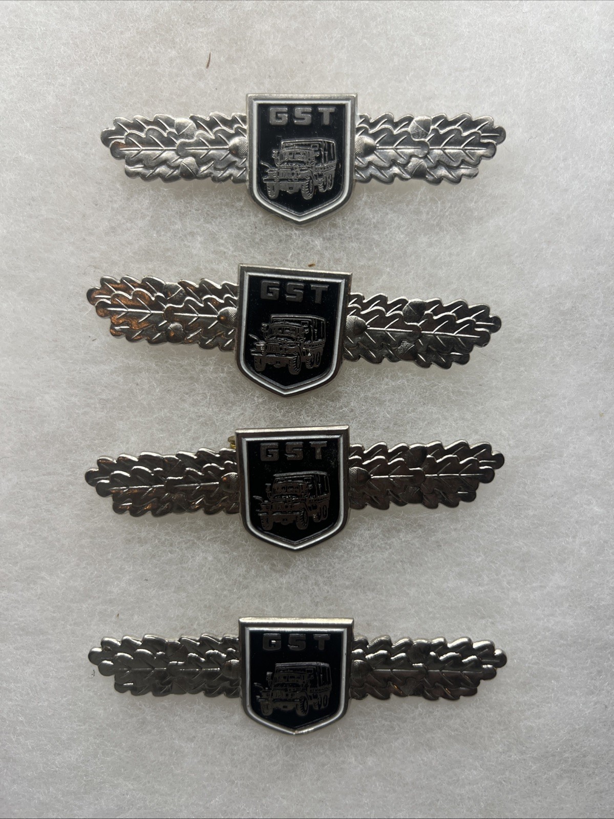 Lot Of 4 East German GST Badges (FF442