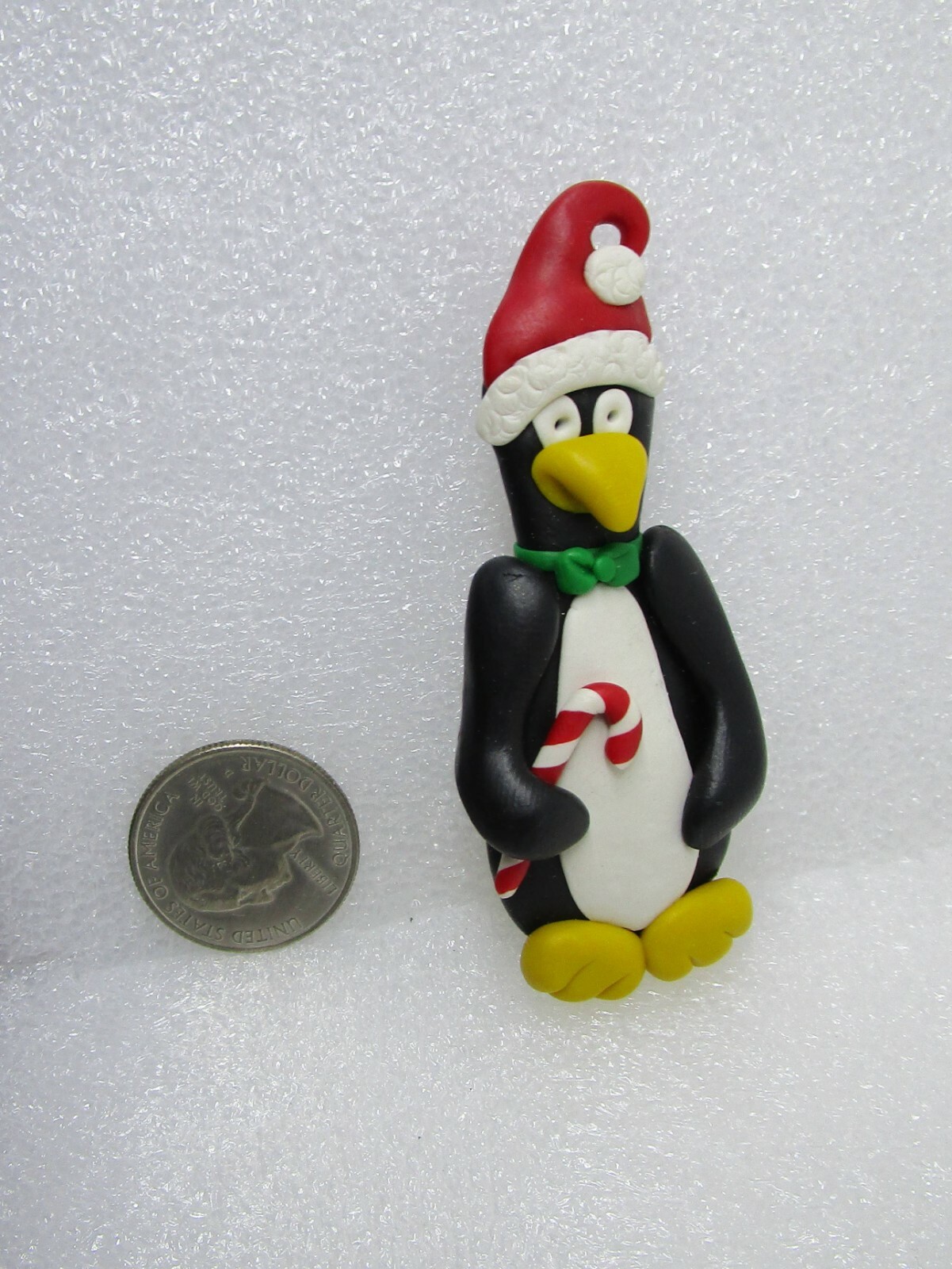 Gone Troppo Handcrafted Clay Penguin Wearing Santa Hat Holding Candy Cane Pin