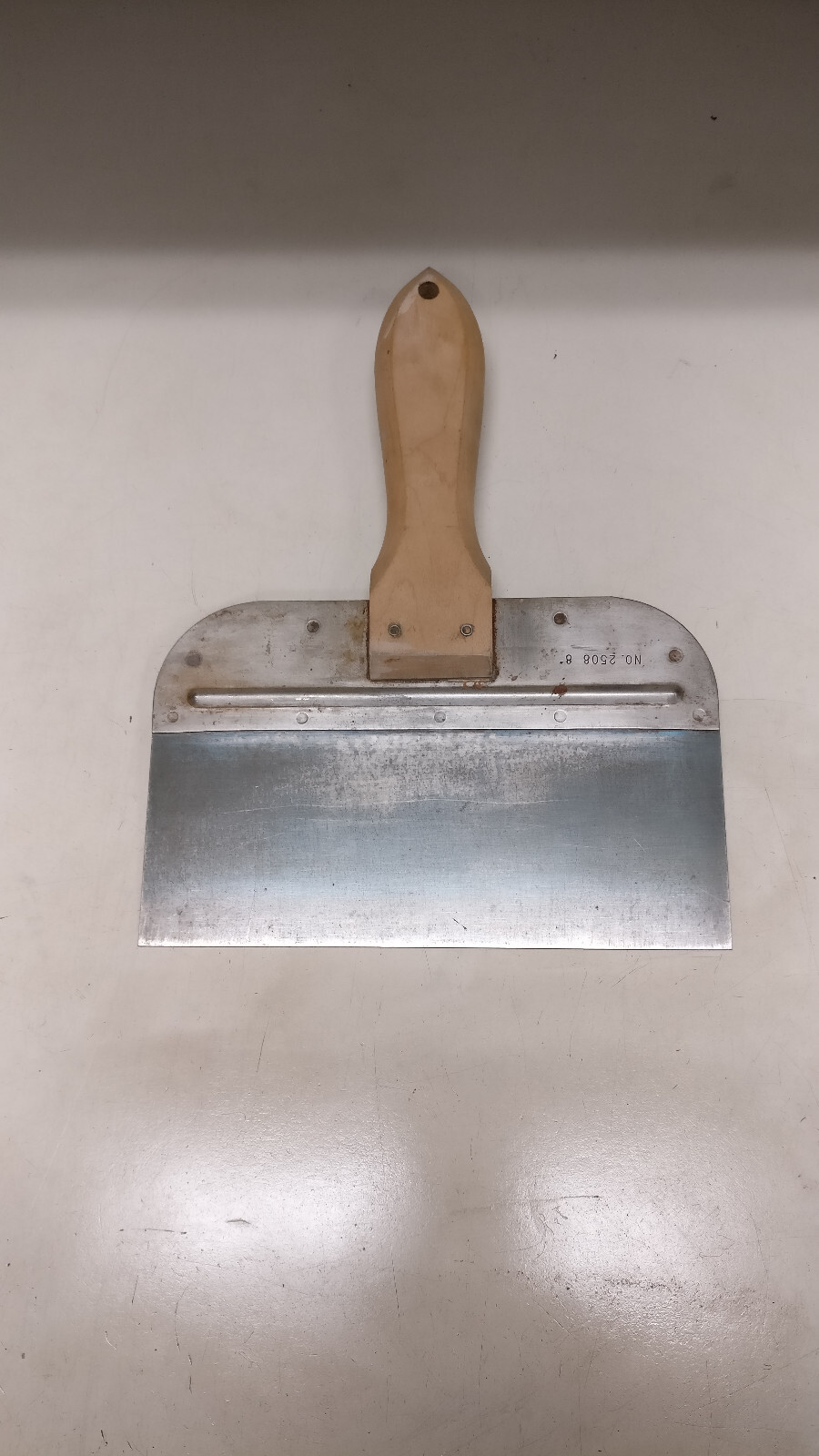Eight assorted drywall/mud tools