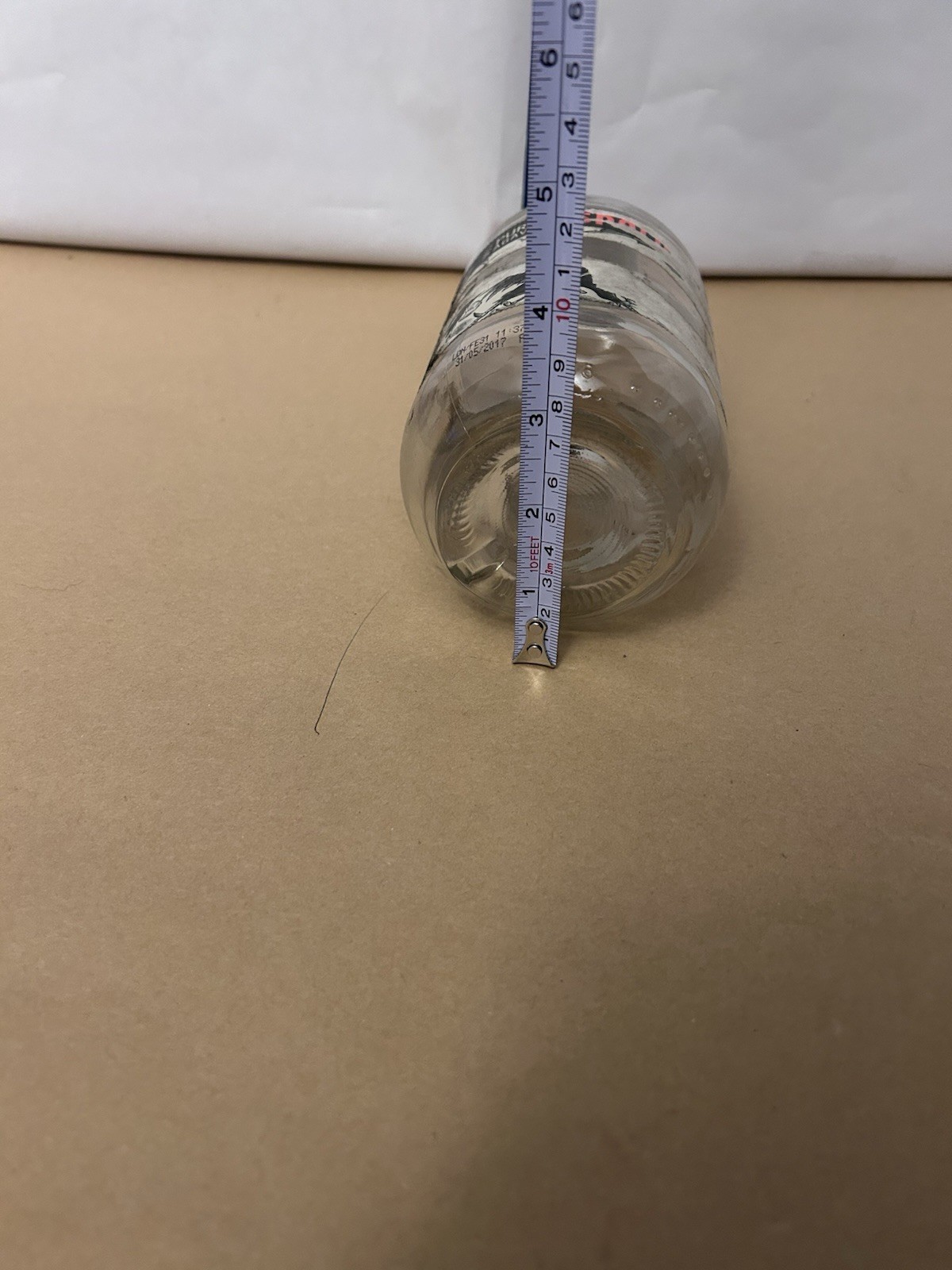 Thick Glass unbranded bottle with cork top likely tequila