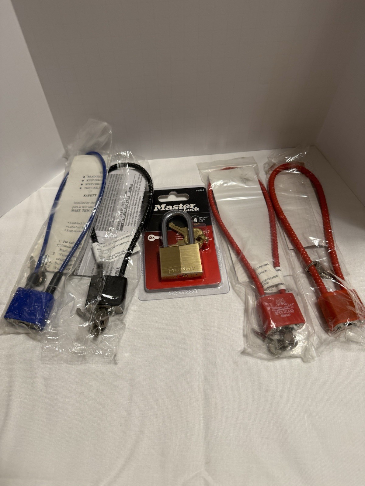 Master Lock NIB; (4) Gun Locks New. Free Shipping