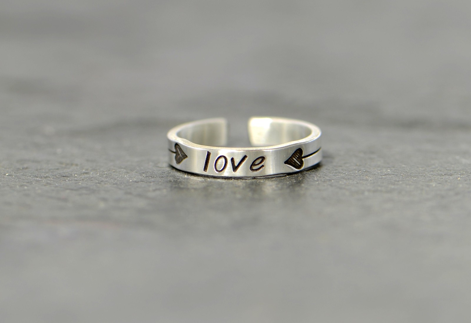 dainty sterling silver toe ring with the word love and 2 heart arrows - midi