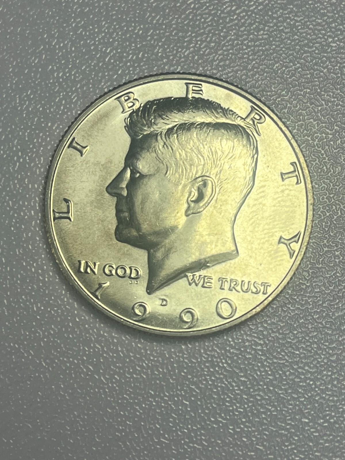 1990-D Clad Almost Uncirculated Kennedy Half Dollar