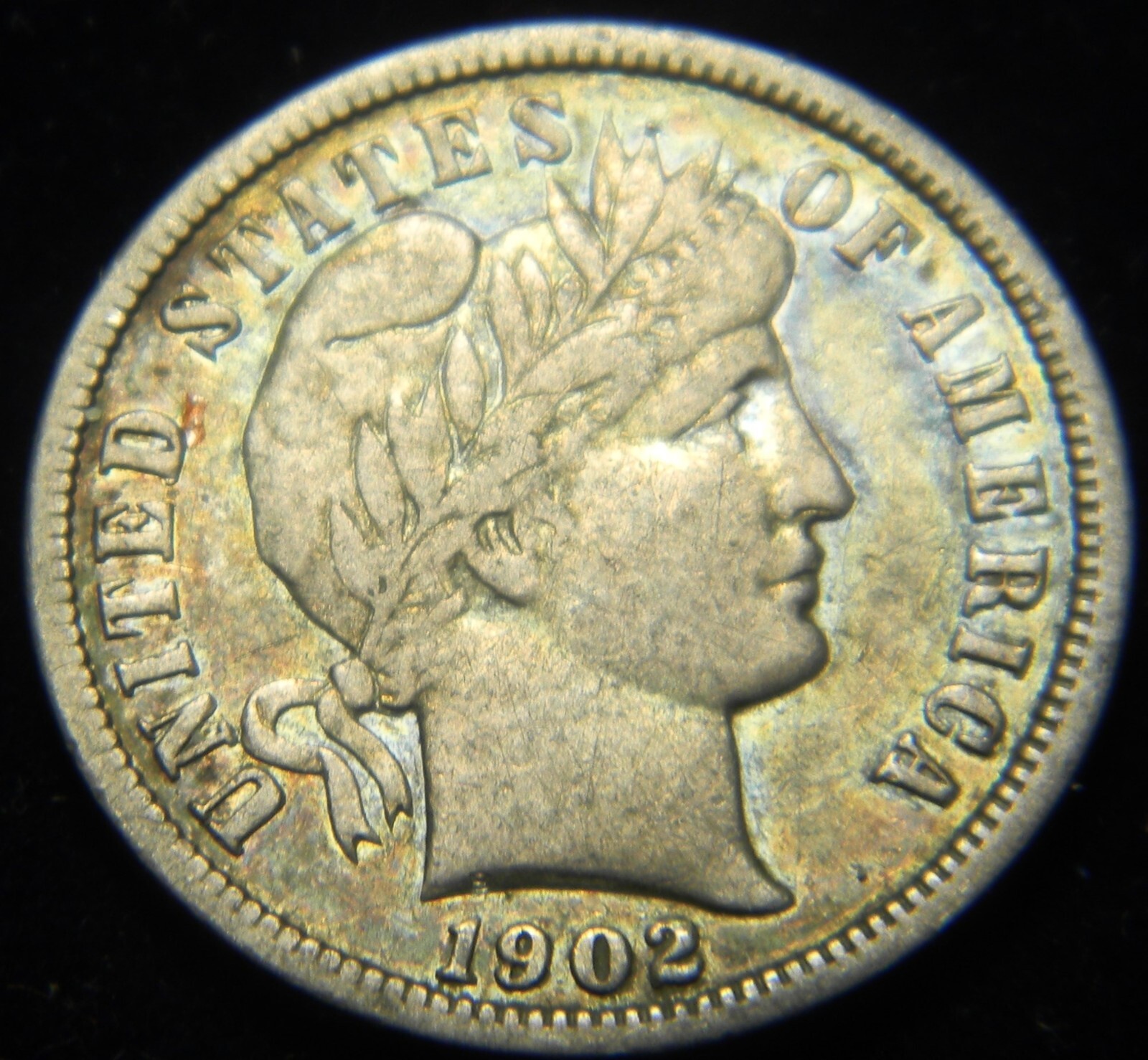 1902-O BARBER DIME, GRADE: XF, PRETTY COLORFUL TONING ON OBVERSE AND REVERSE