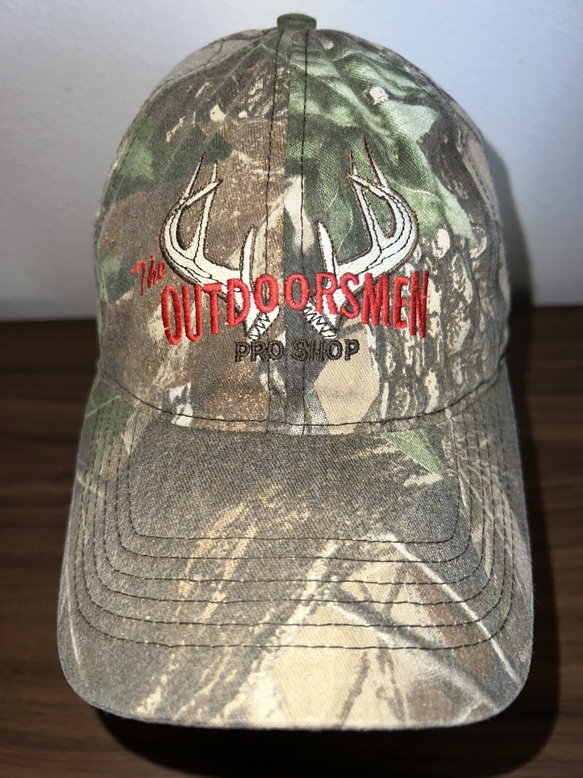 The Outdoorsmen Pro Shop with Deer antlers Camouflage Hat Cap Hook Loop EUC
