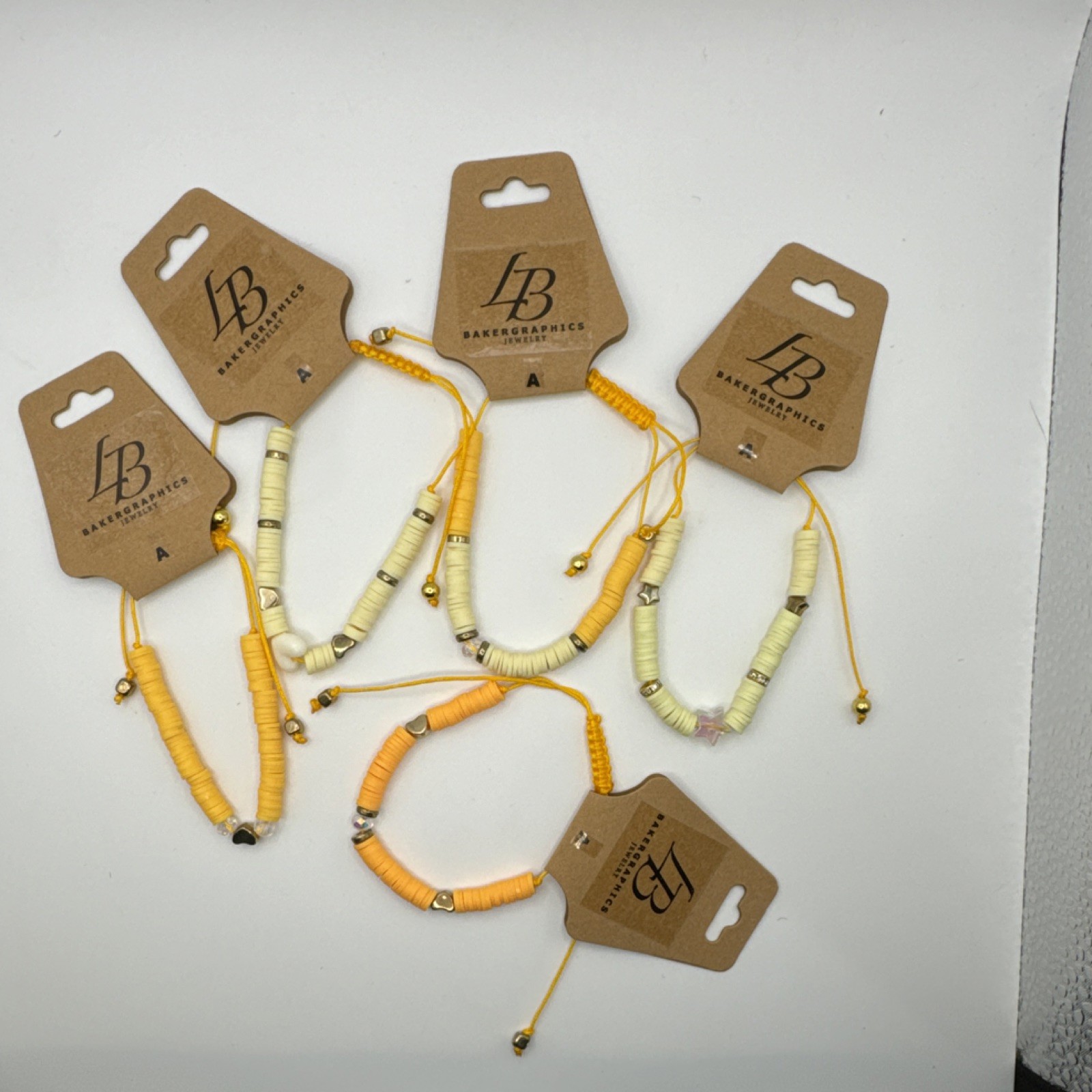 Bakergraphics Jewelry Yellow Cream Beaded Adjustable Charm Bracelets Set