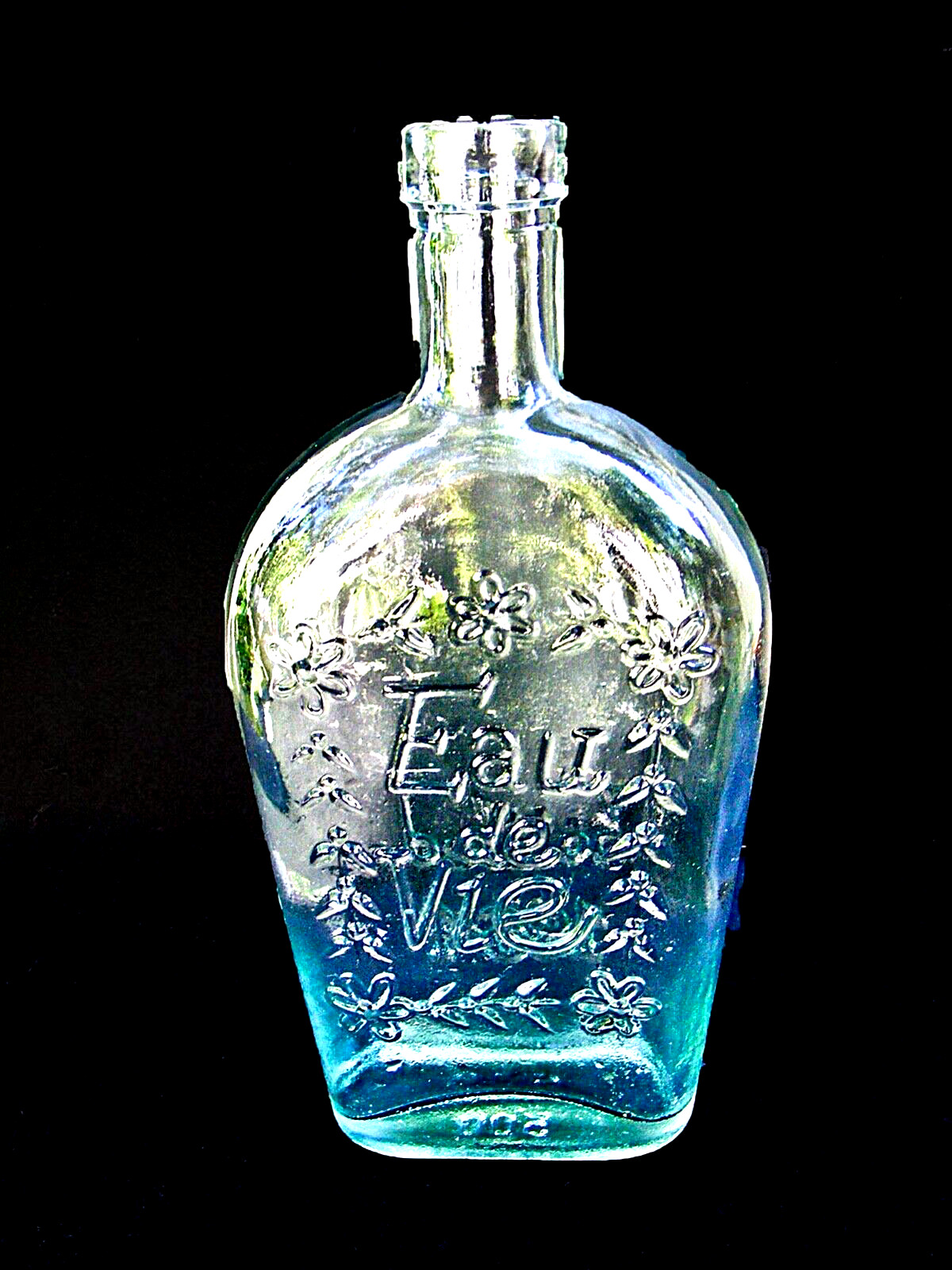 VINTAGE EAU DE VIE BOTTLED IN 1864 CLEAR GREEN GLASS COLLECTIBLE BOTTLE