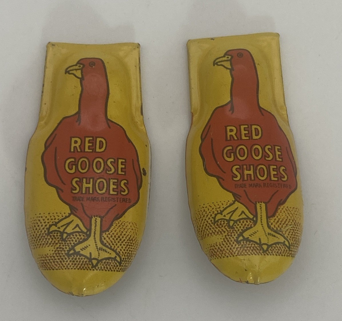 2 - Vintage Red Goose Shoes advertising Cricket Clicker - tin litho - USA 50'S