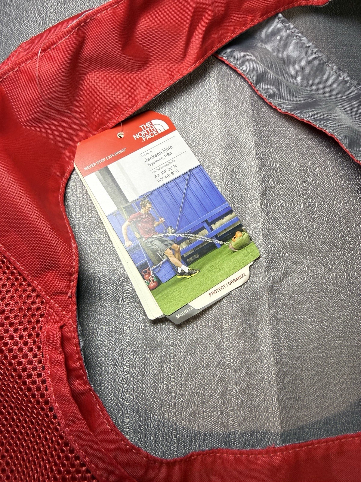 The North Face Mountain Athletics On The Run Bag Red Gray 23L Mesh Pocket