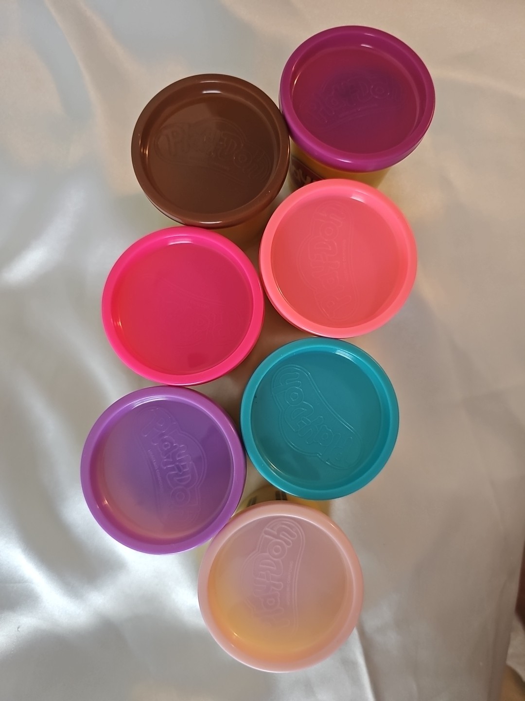 Lot of 7 different colors of Playdoh including Brown, Hot Pink, Lavender, etc.