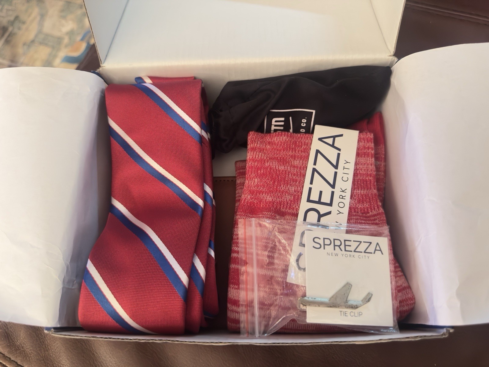 Delta Sprezzabox Red 5-Piece Socks ,Tie ,Tie Clip, Passport Holder, Day Serum