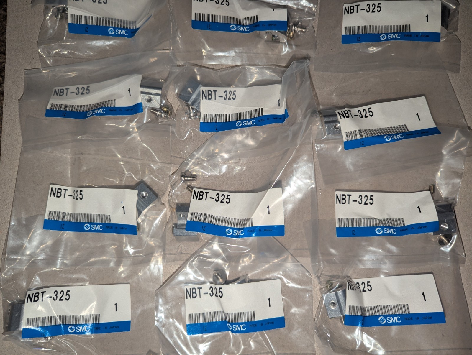 NEW LOT OF 12 GENUINE SMC NBT-325 ACTUATOR BRACKETS