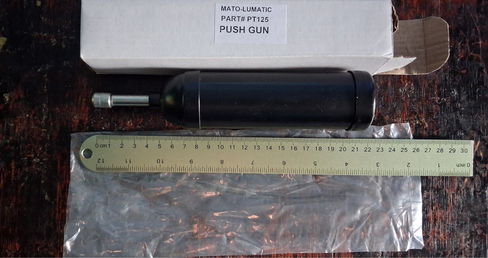 Push Grease Gun. Never used and still in original packaging.