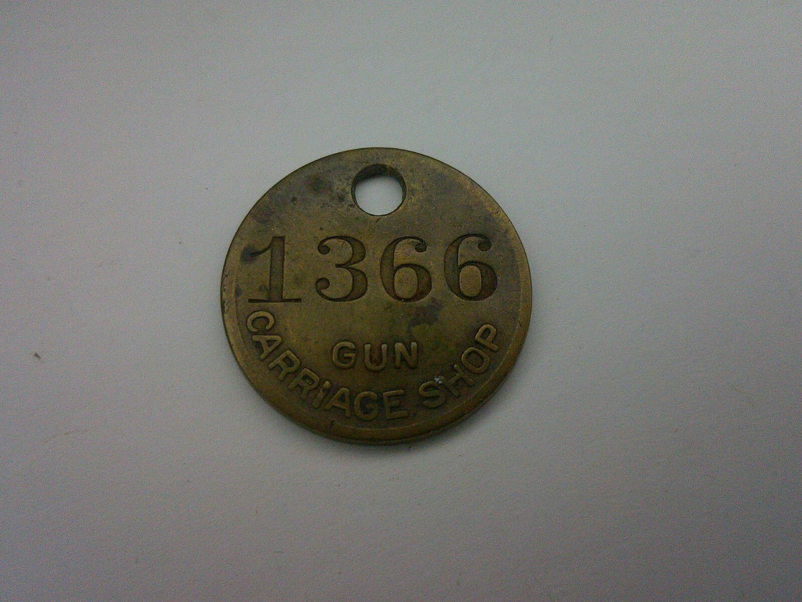 antique gun tag from Carriage gun shop used to identify repaired gun # 1366 Z150
