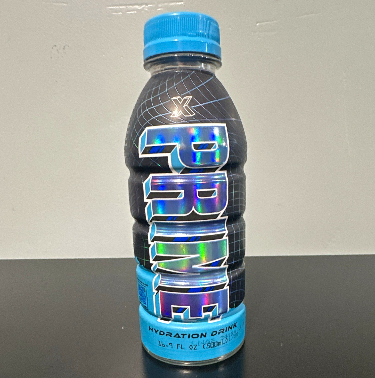 PRIME Hydration Electrolyte Drink X treasure hunt blue holo 16.9 fl oz (expired)