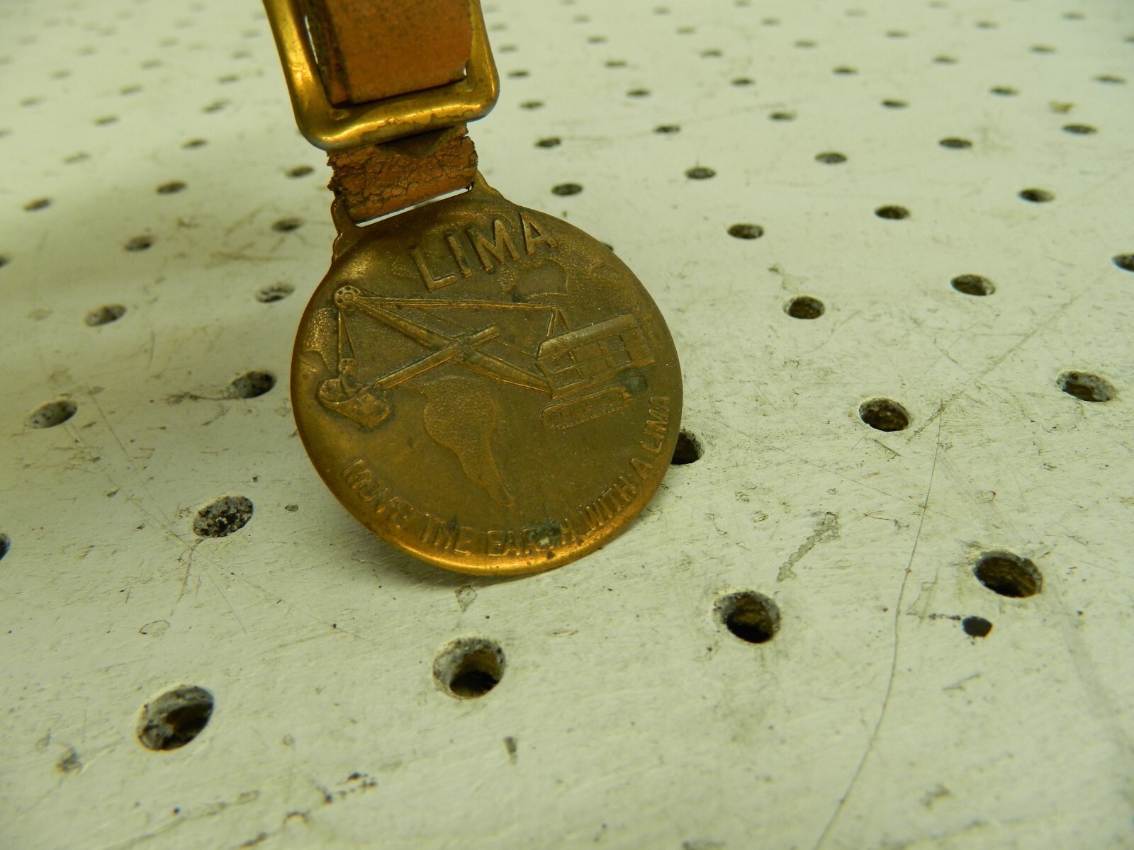 VINTAGE LIMA EARTH MOVING EQUIPMENT FOB LIMA OHIO GREENDUCK WATCH FOB RARE!!