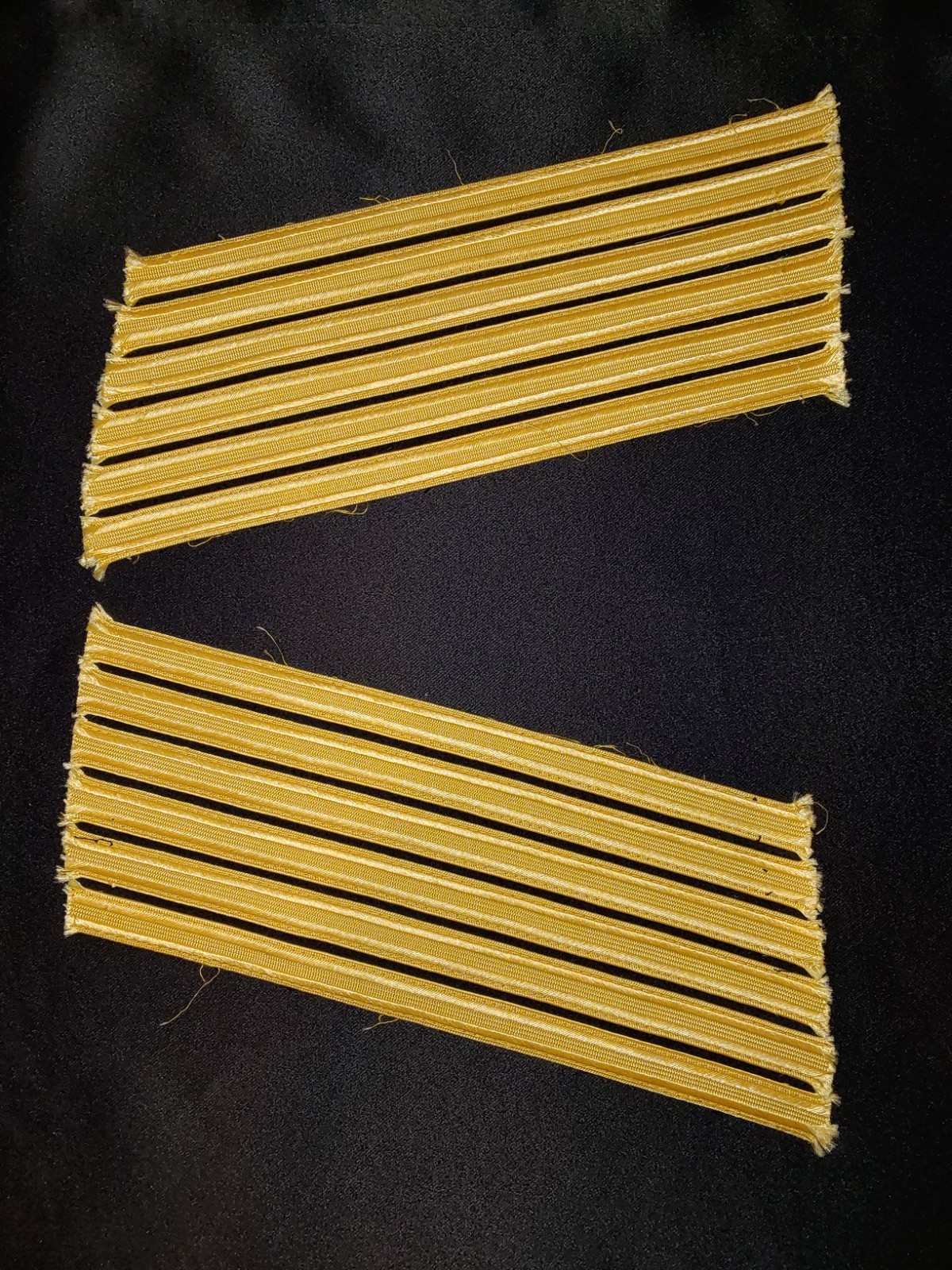 MILITARY SERVICE STRIPES ? OR OTHER GOLD ON BLACK
