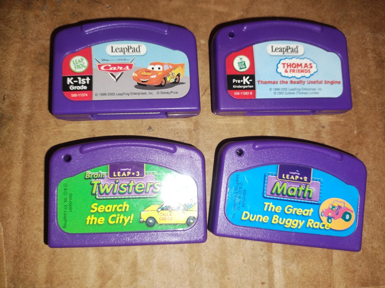 Lot of 4 Leap Frog Leapster Game Cartridges Cars Thomas & Friends Brain Twisters