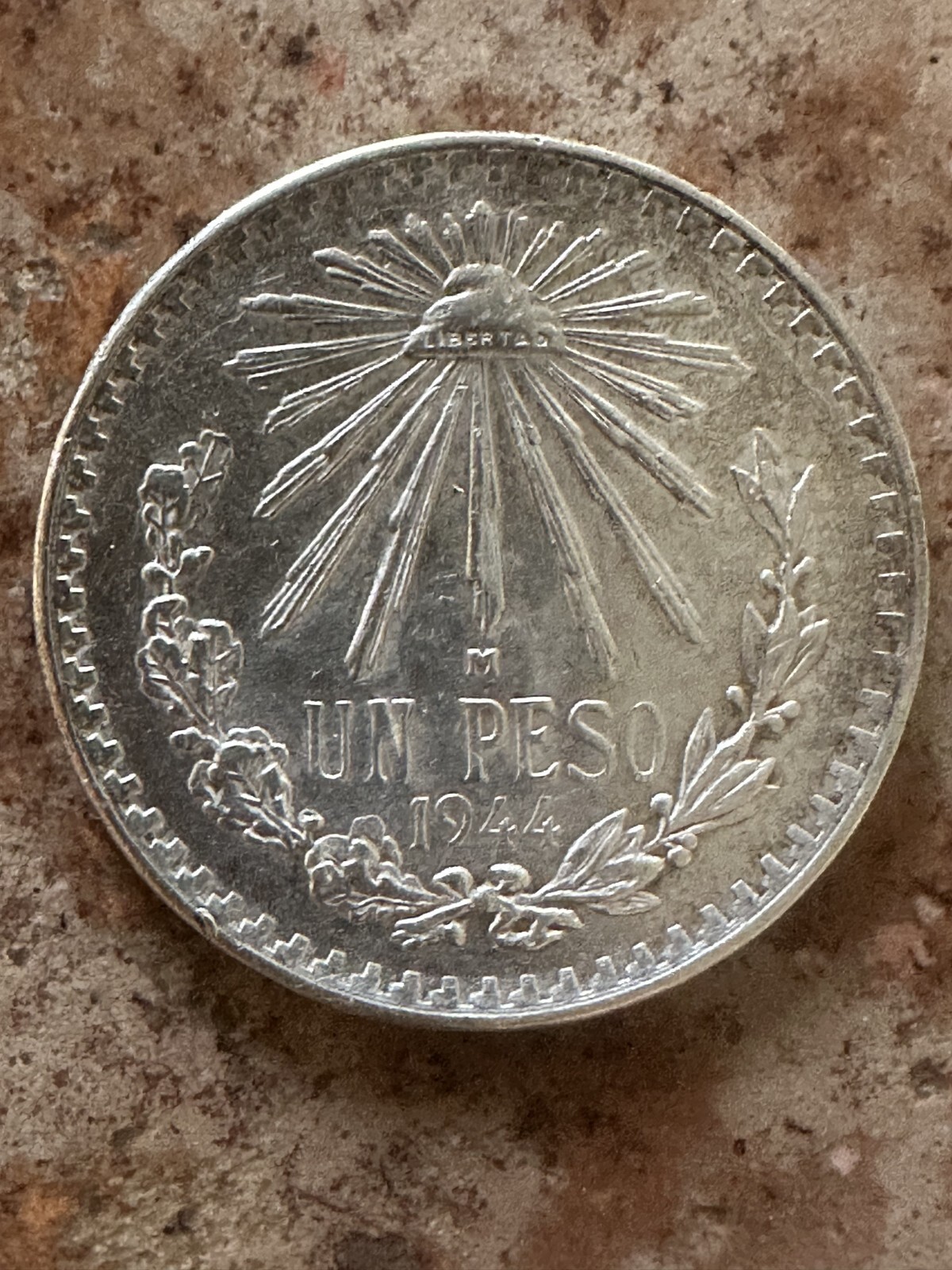 1944 ONE MEXICAN PESO STERLING SILVER WITH COPPER COIN .  .3856 oz of silver.