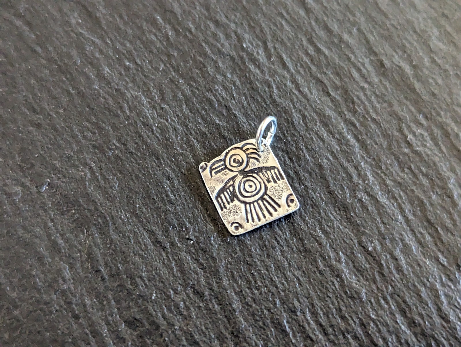 Tiny sterling silver charm with a bird sumbol - handmade - freeform