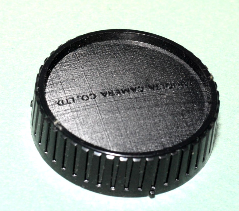 MINOLTA  BAYONET REAR LENS CAP.