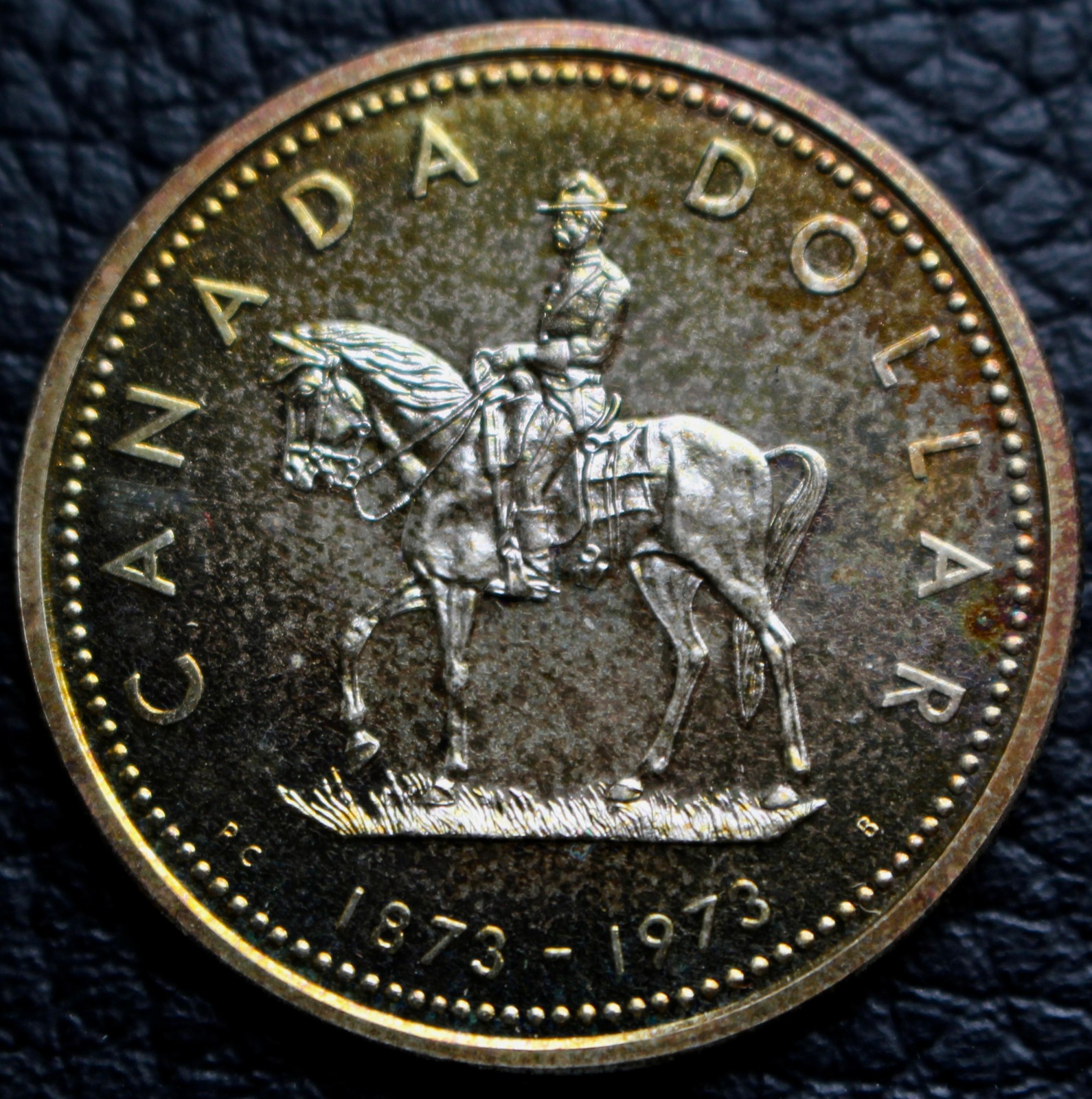 1973 CANADA $1 DOLLAR - SILVER - 100th Anniversary of the RCMP - Rainbow Toned