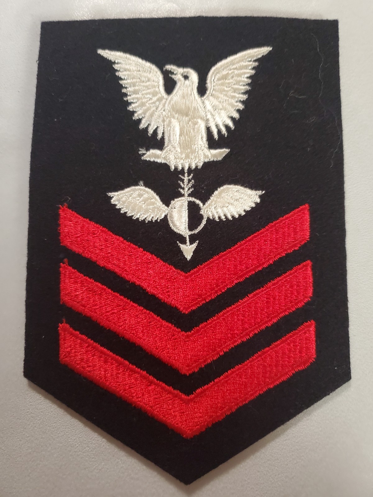 United States Navy Petty Officer 1st Class rating badge  Aerographer's Mate