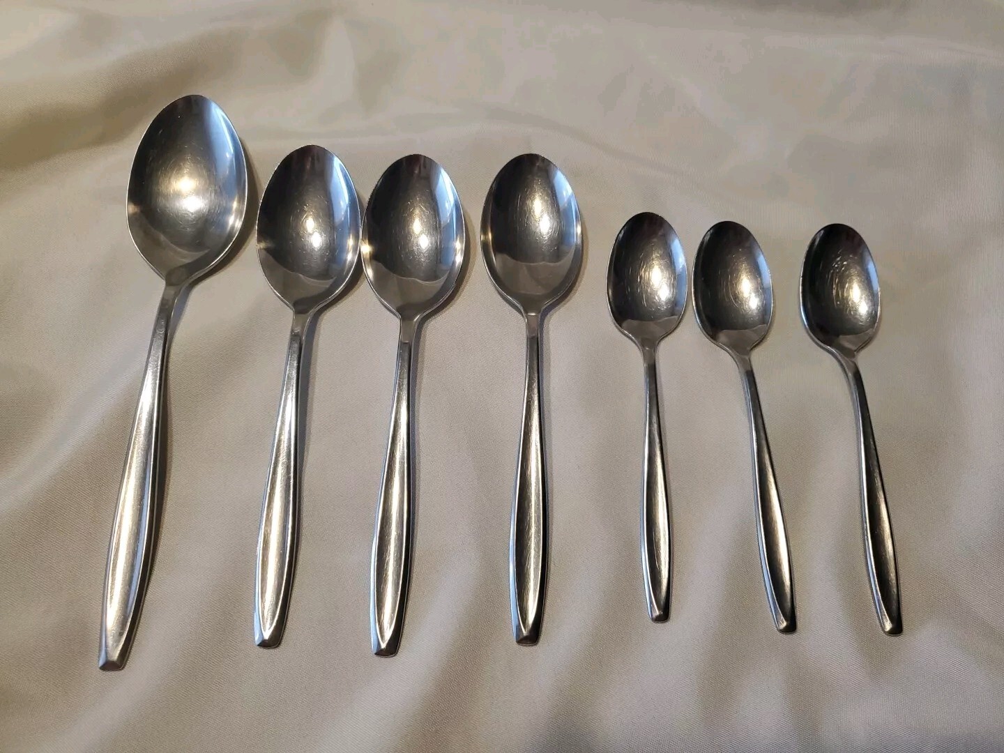 International Stainless NEW DAWN Spoon Lot.  Serving, Table & Tea Spoons. A7