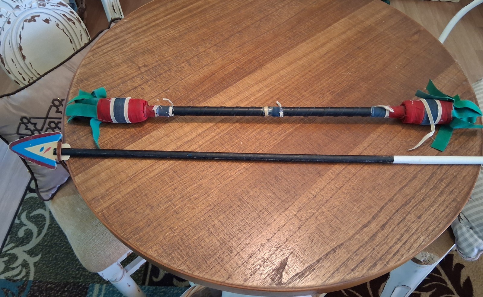 One native American juggling stick & one rubber tipped arrow.