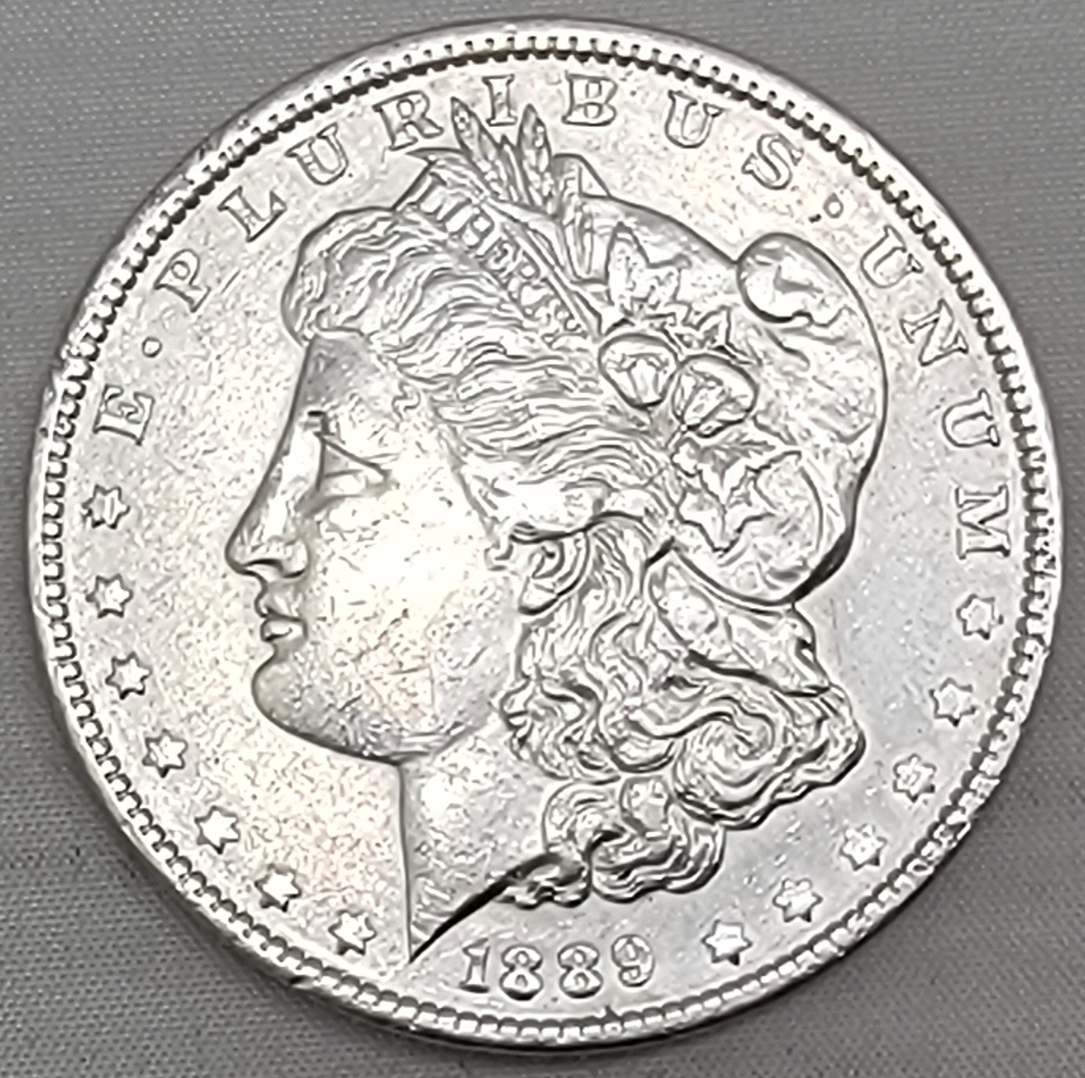 1889-P MORGAN SILVER DOLLAR IN HIGH-QUALITY, EXCELLENT DETAIL, CHEST FEATHERS