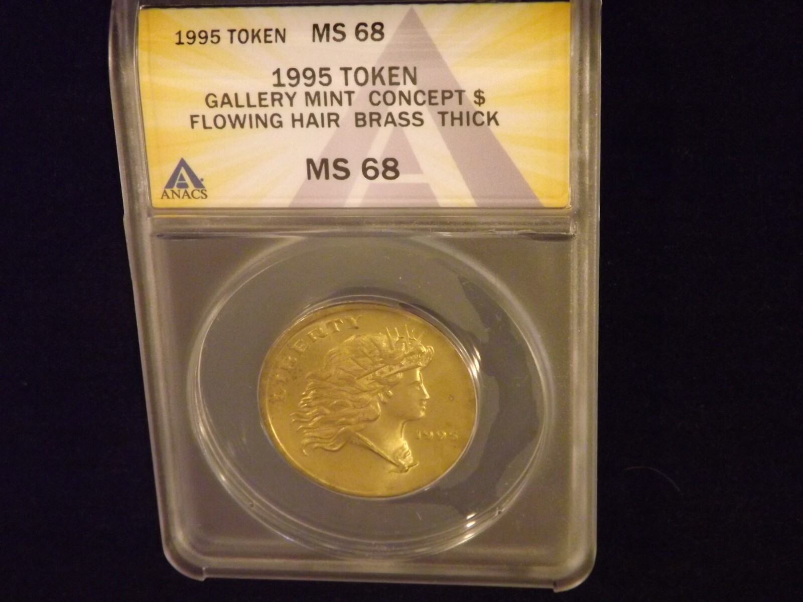 1995   Token         Flowing Hair   Brass           ANACS  MS 68
