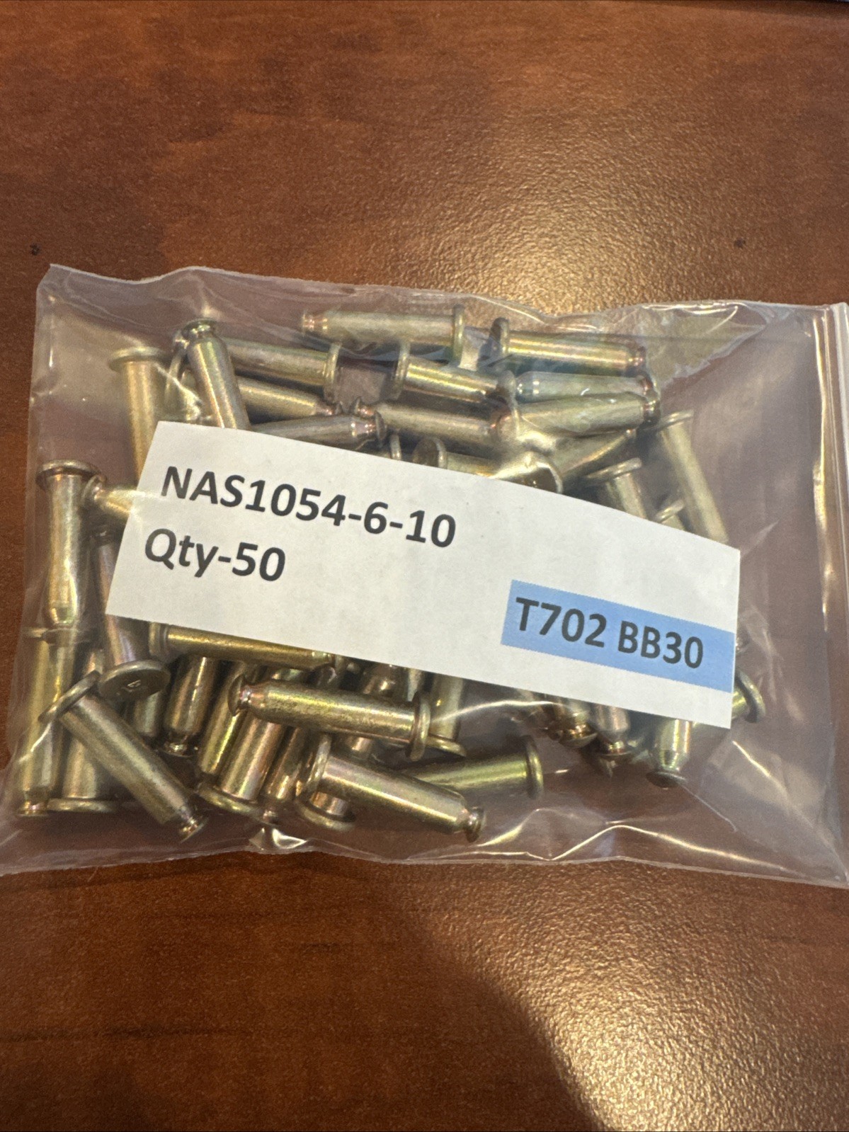 Quantity- 50  NAS1054-6-10 rivets.   New.  T702 BB30