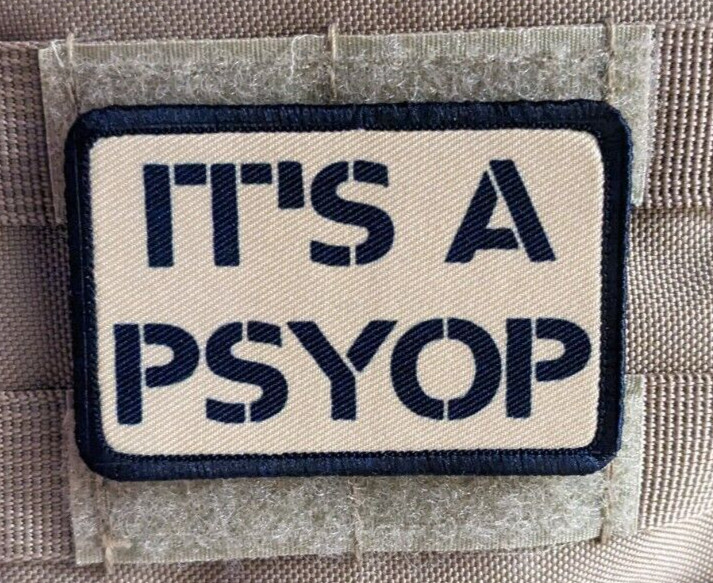 It's a Psyop conspiracy morale patch  2"x3" hook & loop tactical tan