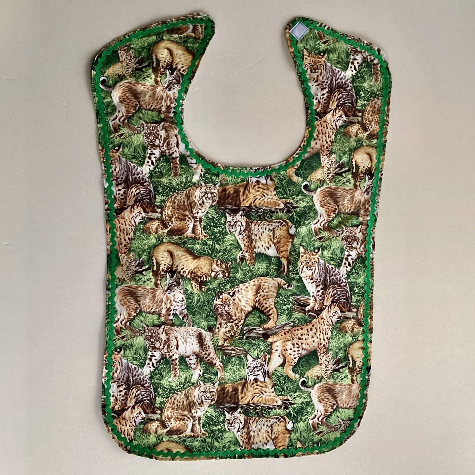ADULT CLOTHING PROTECTOR/ BIB (BOBCATS)