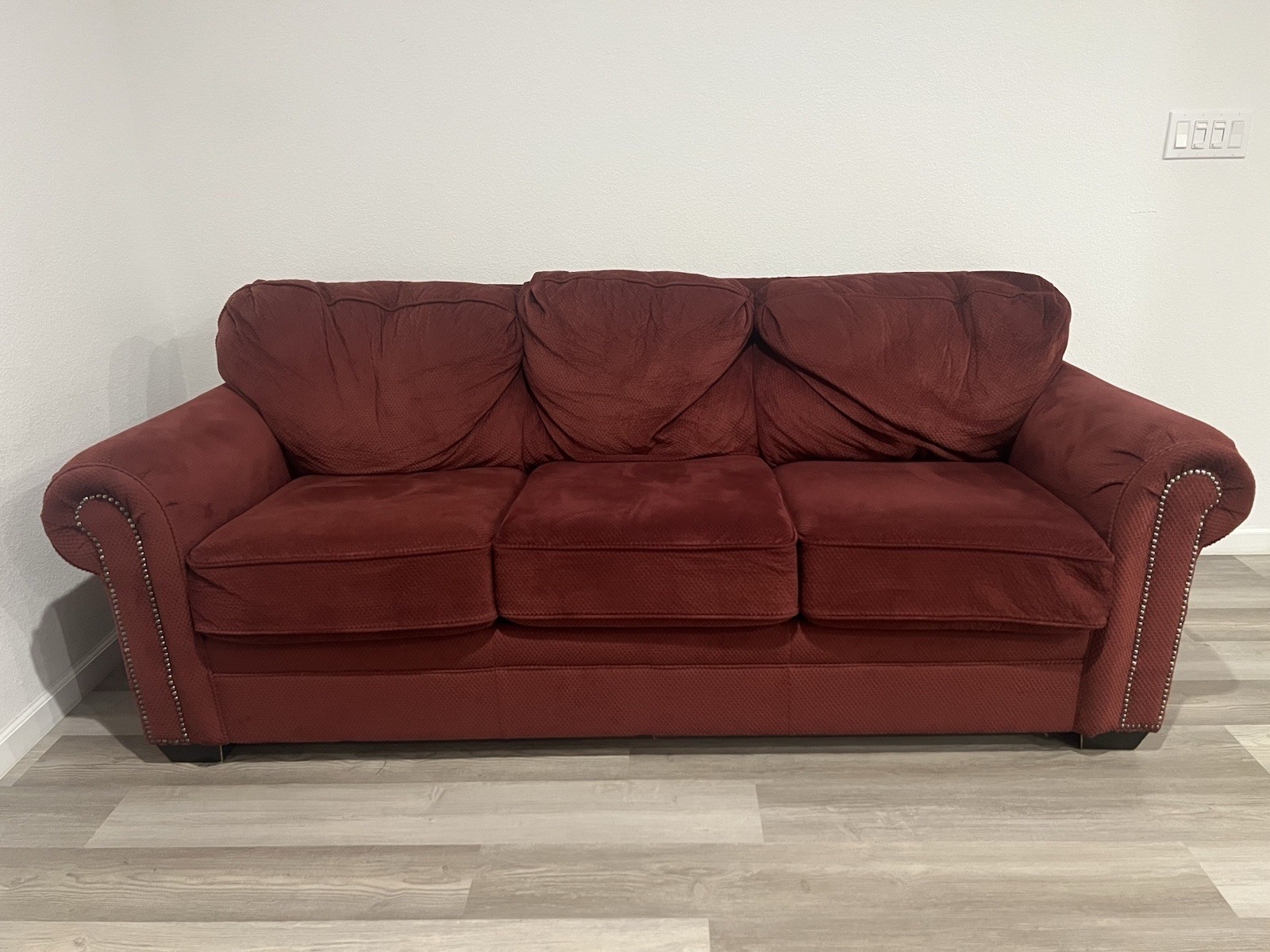 Elegant Deep Red Couch for a Cozy, Stylish Living Space