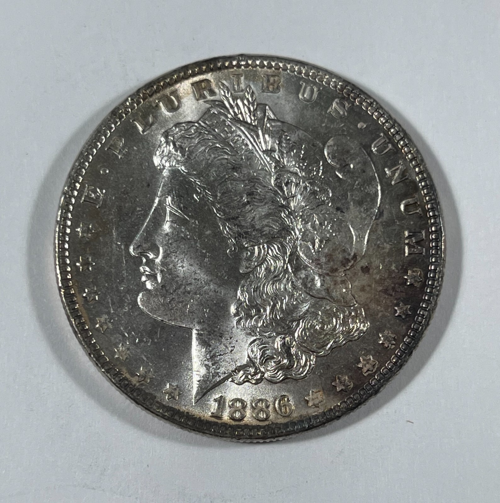 1886 Morgan dollar (#21868) BU+ Colorful Rev. toning