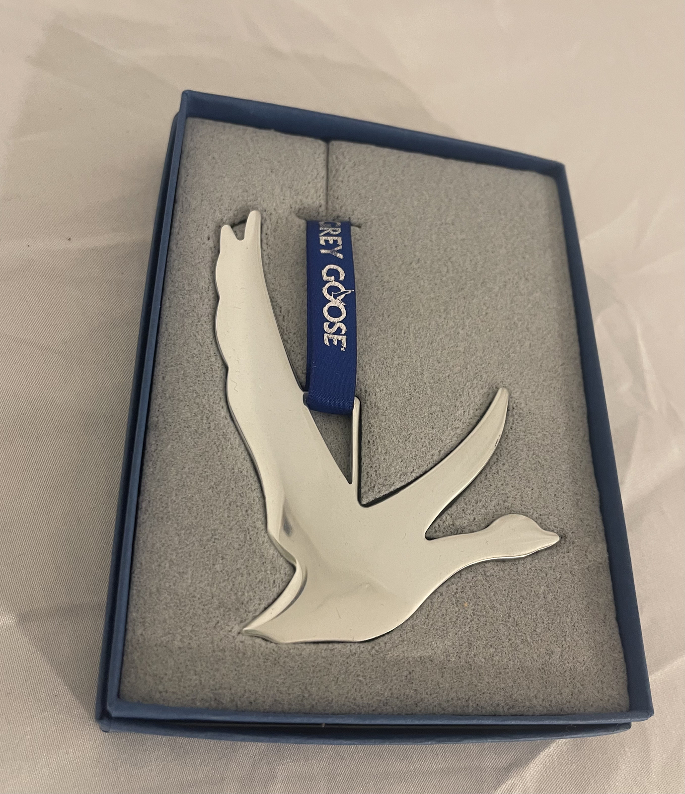 Grey Goose "Share The Spirit" Silver Tone Metal Goose Ornament W/Blue Ribbon NIP