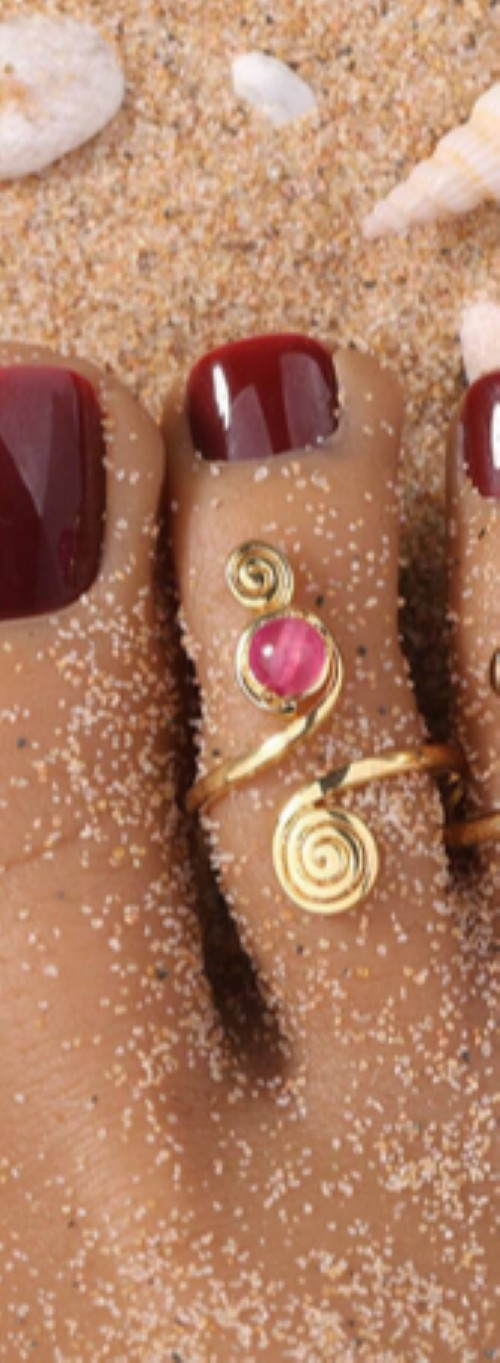 Gold swirl pink stone toe ring
