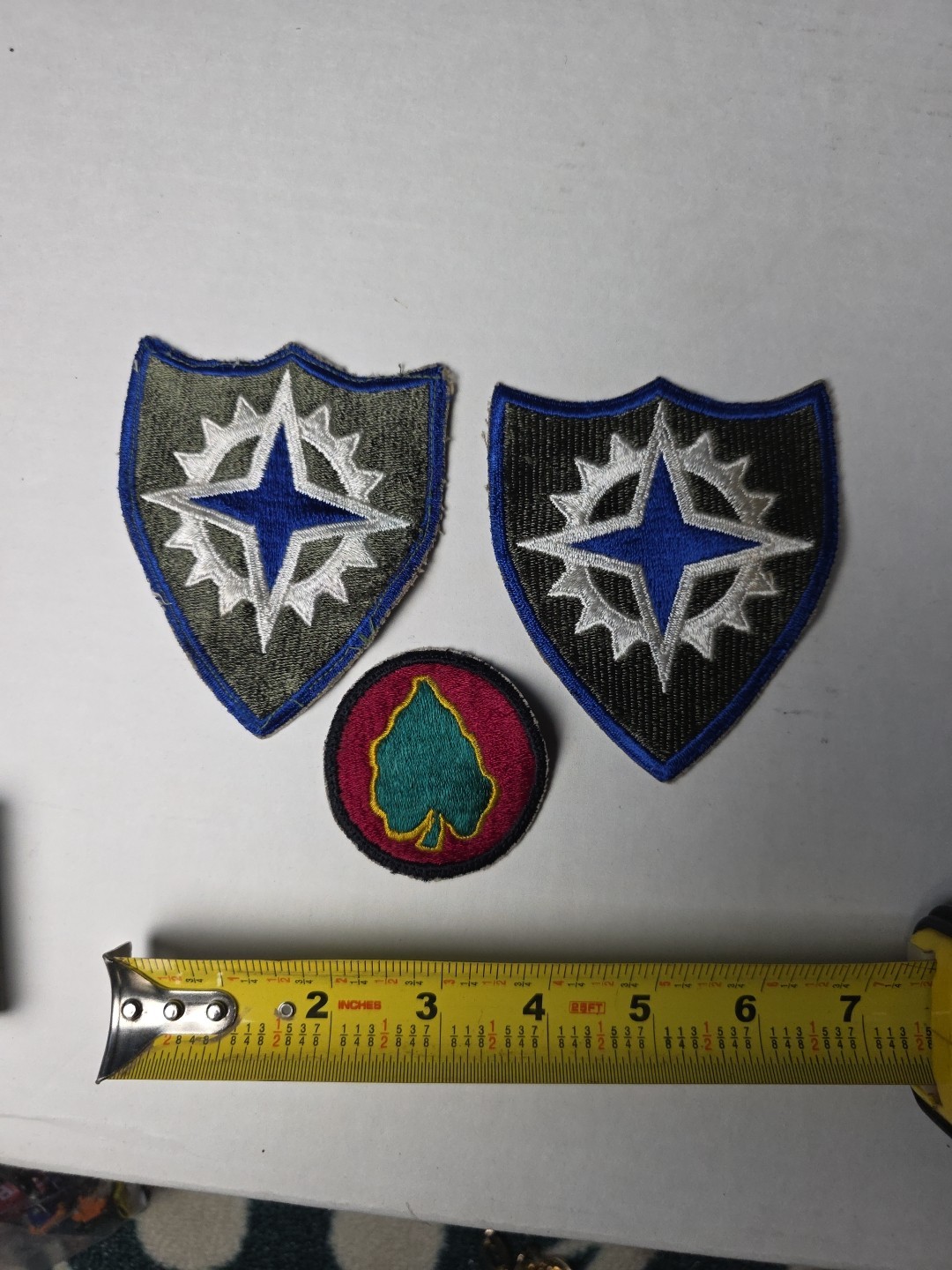 U.S. Army XVI Corps (16th Army Corps) patches, from the World War II era. 1945