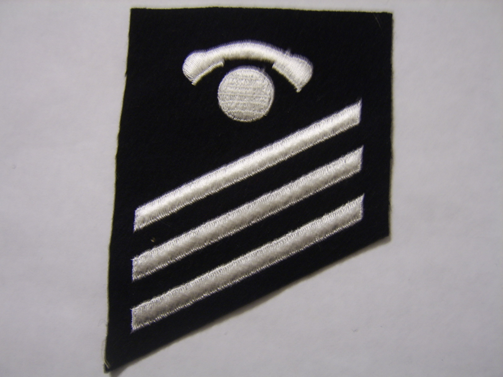 USN STRIKER RATE INSIGNIA - INTERIOR COMMUNICATIONS ELECTRICIAN WHITE ON BLUE