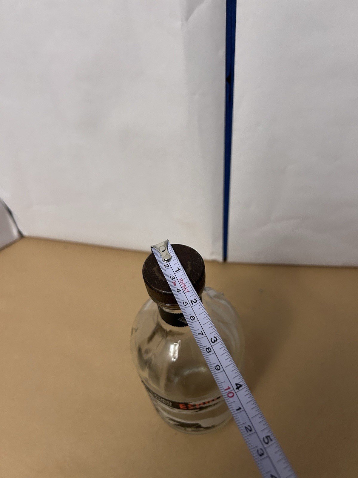 Thick Glass unbranded bottle with cork top likely tequila