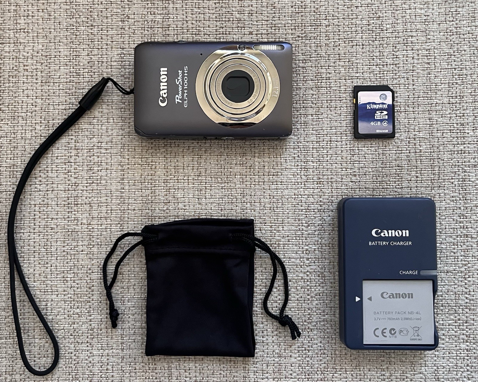 Canon PowerShot ELPH 100HS 12.1MP 4x Zoom Digital Camera + 4GB SD + Charger